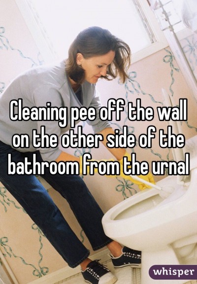 Cleaning pee off the wall on the other side of the bathroom from the urinal